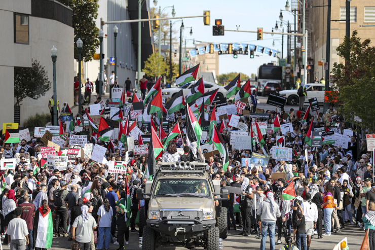 <strong>Demonstrators hold signs and wave Palestinian flags during a rally in support of Gaza and Palestine as they march down Beale Street on Sunday, October 22, 2023.</strong> (Justin Ford/Special to The Daily Memphian)