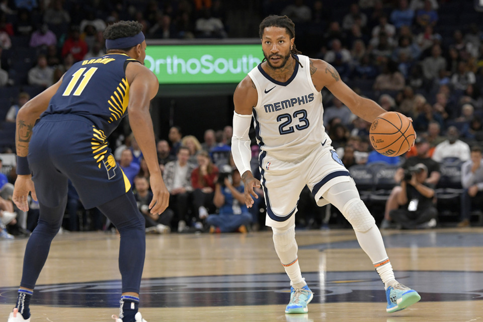 <strong>Memphis Grizzlies guard Derrick Rose (23) handles the ball against Indiana Pacers forward Bruce Brown (11) in the first half of an NBA preseason basketball game Oct. 8 in Memphis.</strong> (Brandon Dill/AP file)