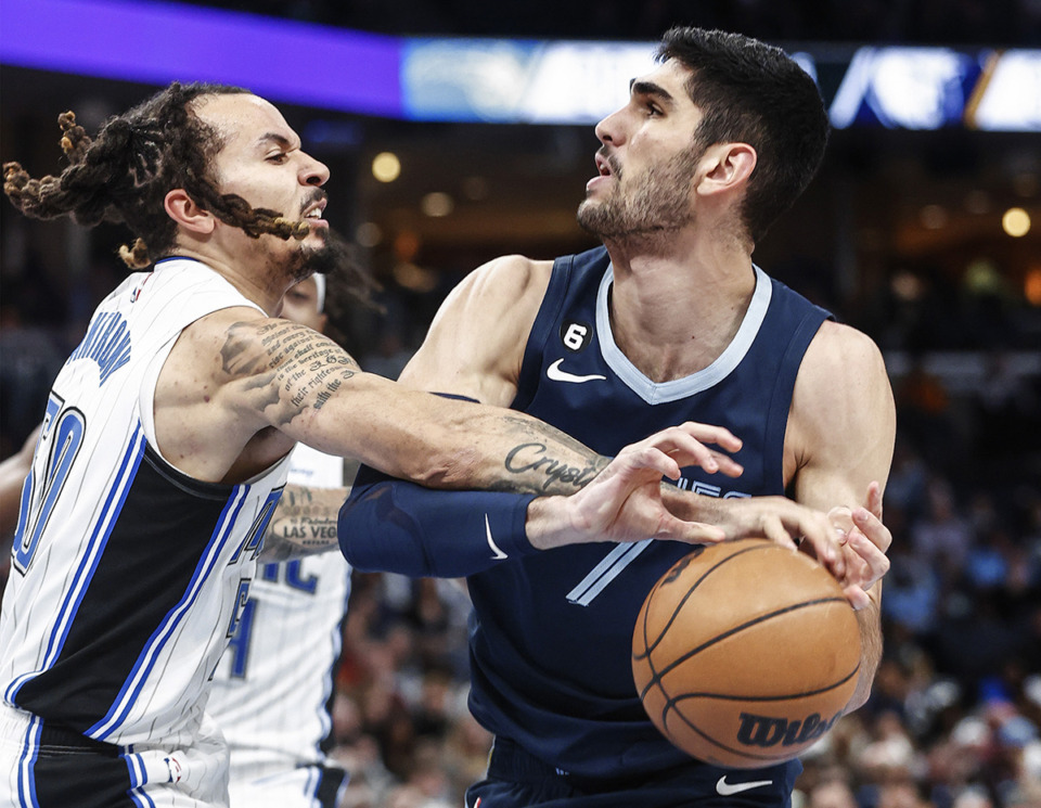 <strong>Memphis Grizzlies guard Santi Aldama, right, has the ball striped away by Orlando Magic defender Cole Anthony, left, during action March 28.</strong> (Mark Weber/The Daily Memphian file)