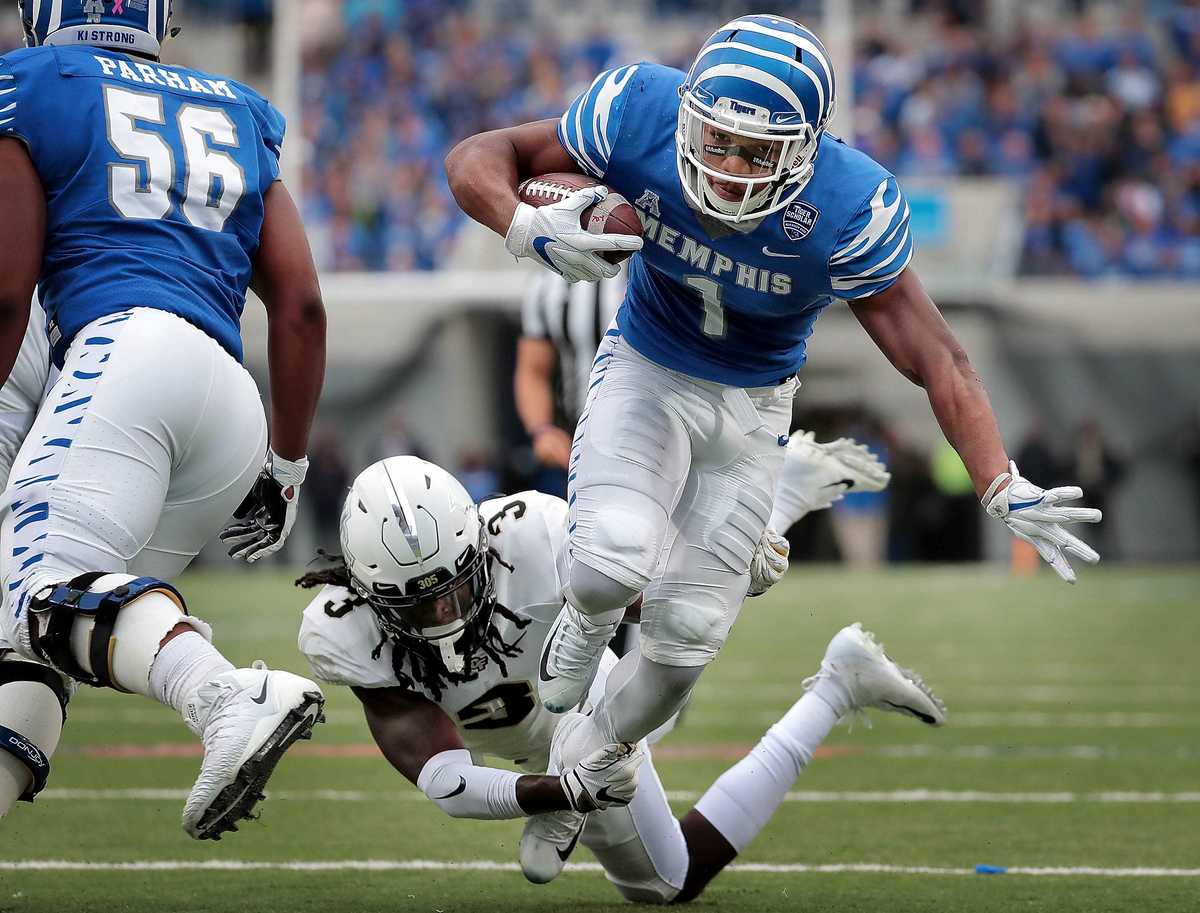 <strong>University of Memphis running back Tony Pollard (1) is taken down by Antwan Collier (3) just shy of the endzone during the Tigers' disappointing 31-30 loss to UCF at the Liberty Bowl Memorial Stadium on Oct. 13, 2018.</strong> (Jim Weber/Daily Memphian)