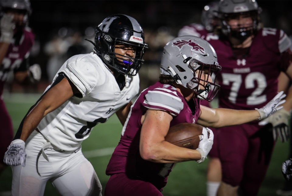 <strong>Collierville running back Logan Davis (11) rushes the ball during the Oct. 27, 2023, game against Houston.</strong> (Patrick Lantrip/The Daily Memphian)