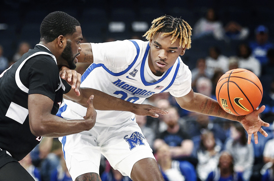 <strong>University of Memphis forward JJ Taylor (right) loose control of the ball against Lane College during action on Sunday, Oct. 29.</strong> (Mark Weber/The Daily Memphian)