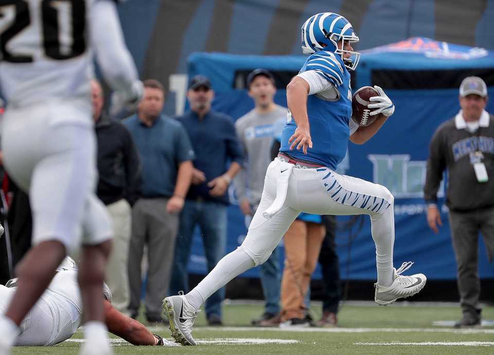 <strong>University of Memphis quarterback Brady White runs in for a touchdown during the Tigers' disappointing 31-30 loss to UCF at the Liberty Bowl Memorial Stadium on Oct. 13, 2018.</strong> (Jim Weber/Daily Memphian)