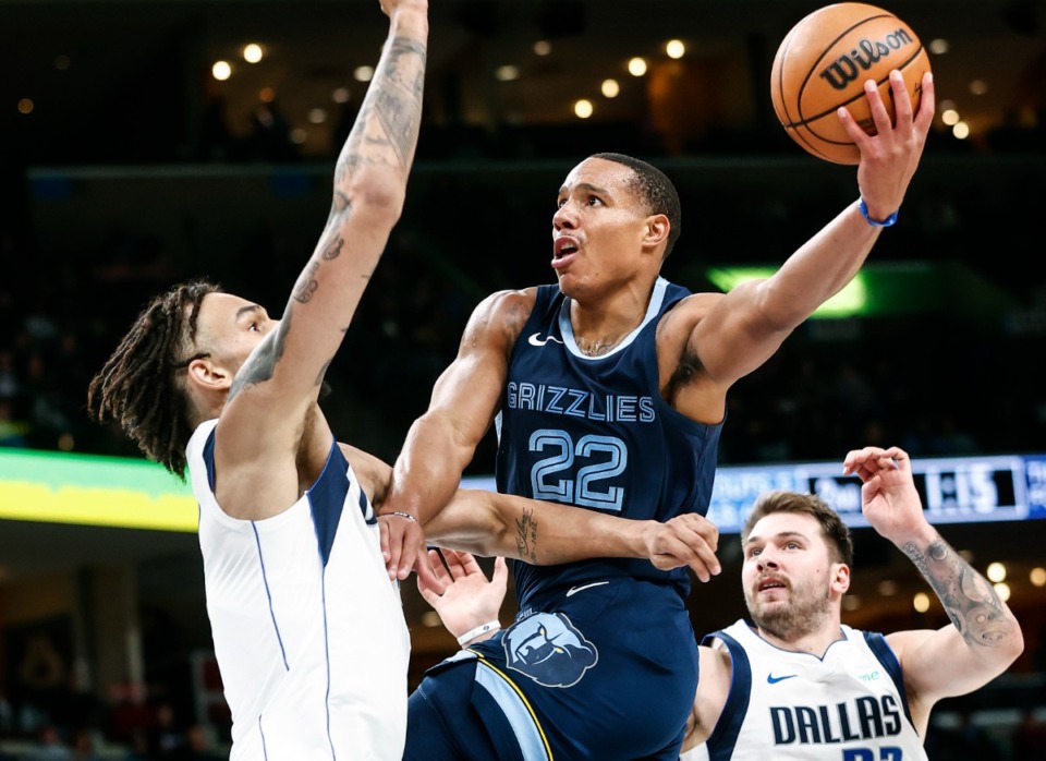 <strong>Memphis Grizzlies guard Desmond Bane (middle) drives to the basket against Dallas Mavericks defender Dereck Lively II (left) and Luka Doncic (right) on Oct. 30.</strong> (Mark Weber/The Daily Memphian)