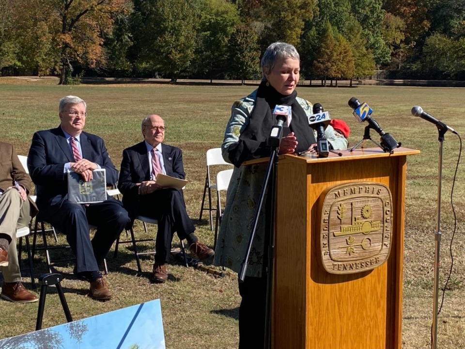 <strong>Overton Park Conservancy director Tina Sullivan, speaking, says federal funding for the Memphis Zoo parking plan will have an impact on a new walking trail, upgrade of Rainbow Lake and pavilion beyond&nbsp; the immediate parking goal.</strong>&nbsp;<strong>Seated behind her are Memphis Mayor Jim Strickland, left, and U.S. Rep. Steve Cohen.</strong> (Bill Dries/The Daily Memphian)