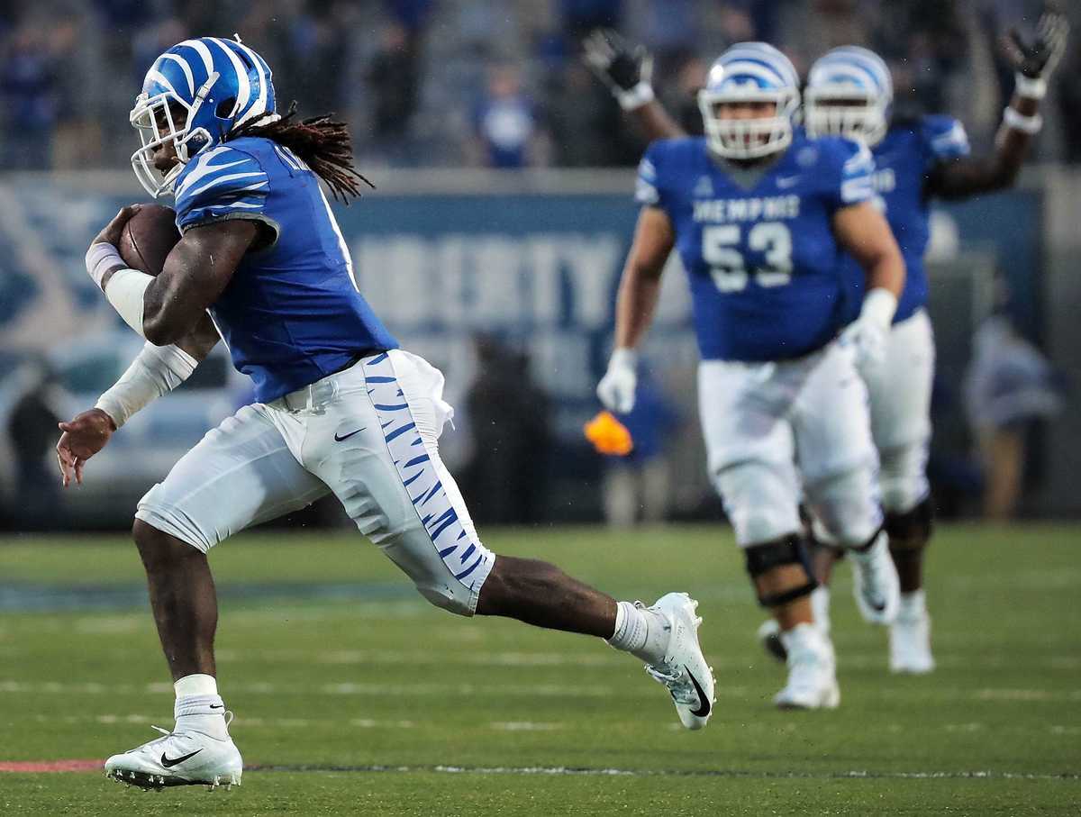 <strong>University of Memphis running back Darrell Henderson (8) runs in for a defunct touchdown after a penalty flag was thrown in the last minutes of the Tigers' disappointing 31-30 loss to UCF at the Liberty Bowl Memorial Stadium on Oct. 13, 2018.</strong> (Jim Weber/Daily Memphian)