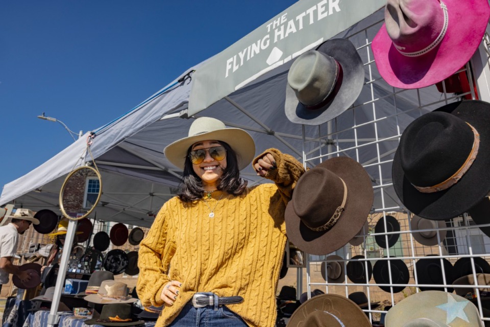<strong>Madison Larese of the Flying Hatter models headgear for sale Nov. 4 during the Broad Avenue District Art Walk.</strong> (Ziggy Mack/Special to The Daily Memphian)