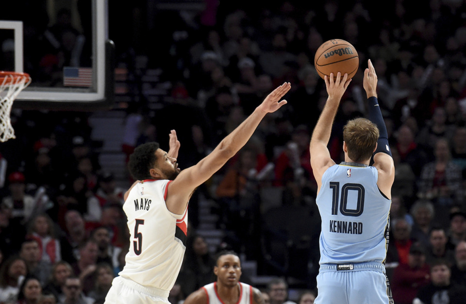 <strong>Memphis Grizzlies guard Luke Kennard, right, hits a basket over Portland Trail Blazers guard Skylar Mays, left, during a game in Portland, Ore., Sunday, Nov. 5.</strong> (Steve Dykes/AP Photo)