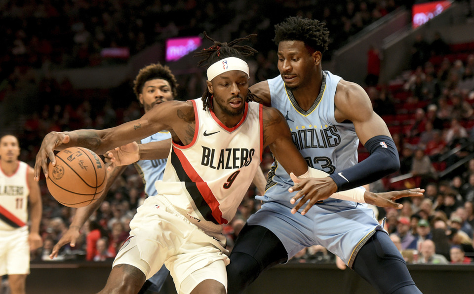 <strong>Portland Trail Blazers forward Jerami Grant, left, drives to the basket against Memphis Grizzlies forward Jaren Jackson Jr., right, during a game in Portland, Ore., Sunday, Nov. 5.</strong> (Steve Dykes/AP Photo)