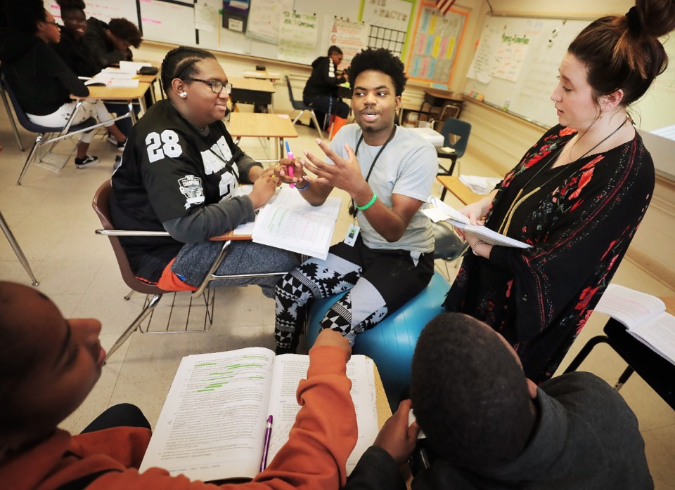 <strong>AP English teacher Savannah Estes (right) works with Amarria Edwards (left) and Jaylen Anderson (center) at MLK College Prep, formerly known as Frayser High on Jan 17, 2019.</strong> (The Daily Memphian file)