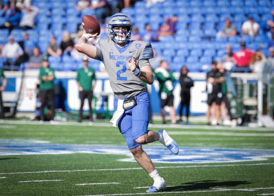 <strong>University of Memphis quarterback Seth Henigan (2) &ldquo;will be back sooner than later,&rdquo; coach Ryan Silverfield said. Henigan rolls out of the pocket during a Nov. 4, 2023 game against USF.</strong> (Patrick Lantrip/The Daily Memphian)