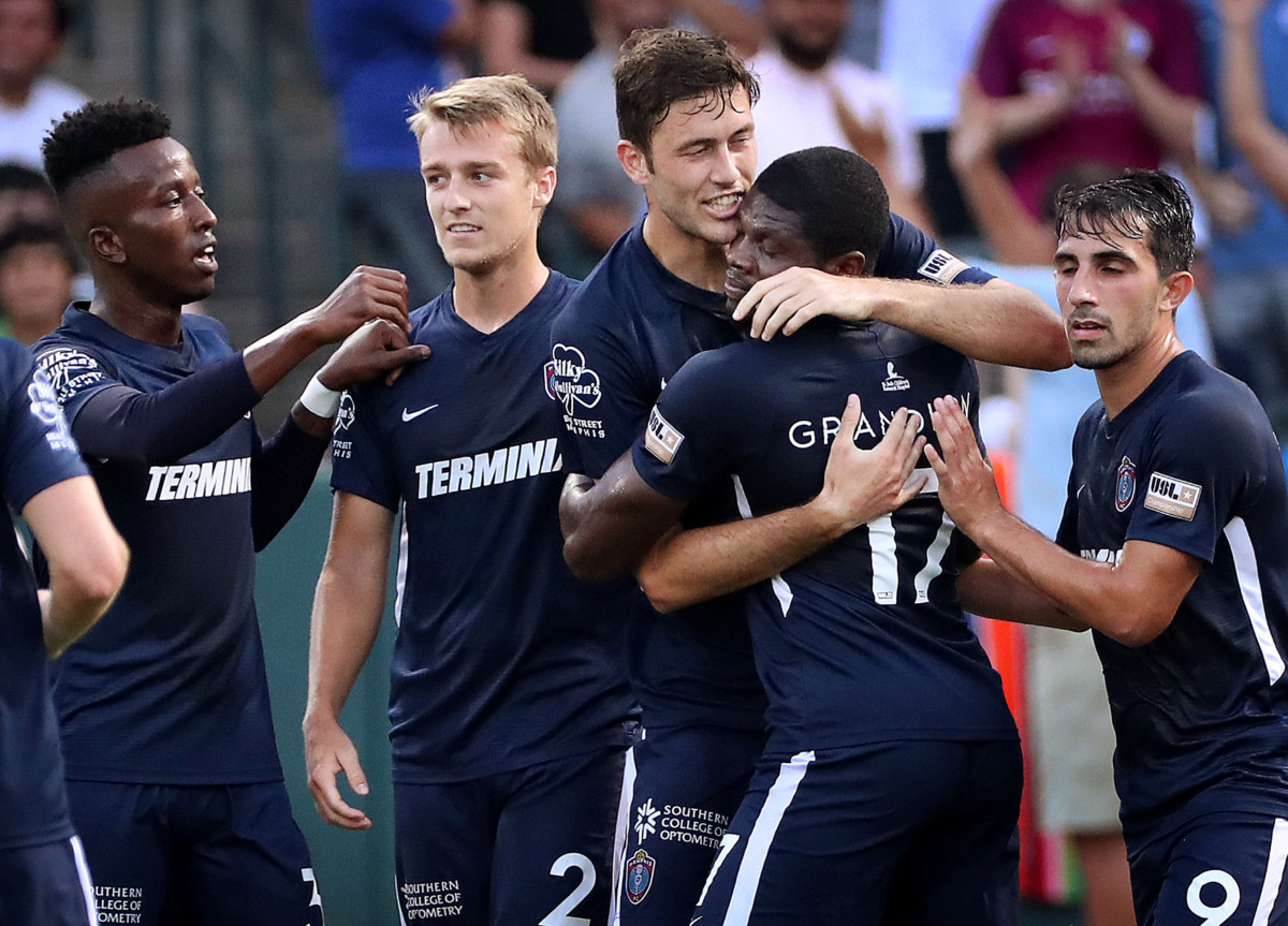 <strong>Memphis forward Elliot Collier (center) celebrates with teammate Ewan Grandison after scoring against Pachuca during 901 FC's 6-1 loss to the squad from Mexico at AutoZone Park.</strong> (Jim Weber/Daily Memphian)