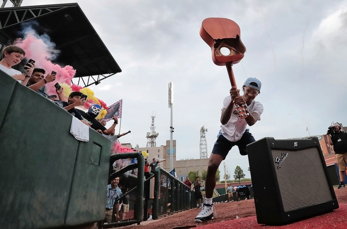 <strong>Grizzlies draft pick Ja Morant crushes the guitar to kick off 901 FC's game against Pachuca in front of a sellout crowd at AutoZone Park.</strong> (Jim Weber/Daily Memphian)