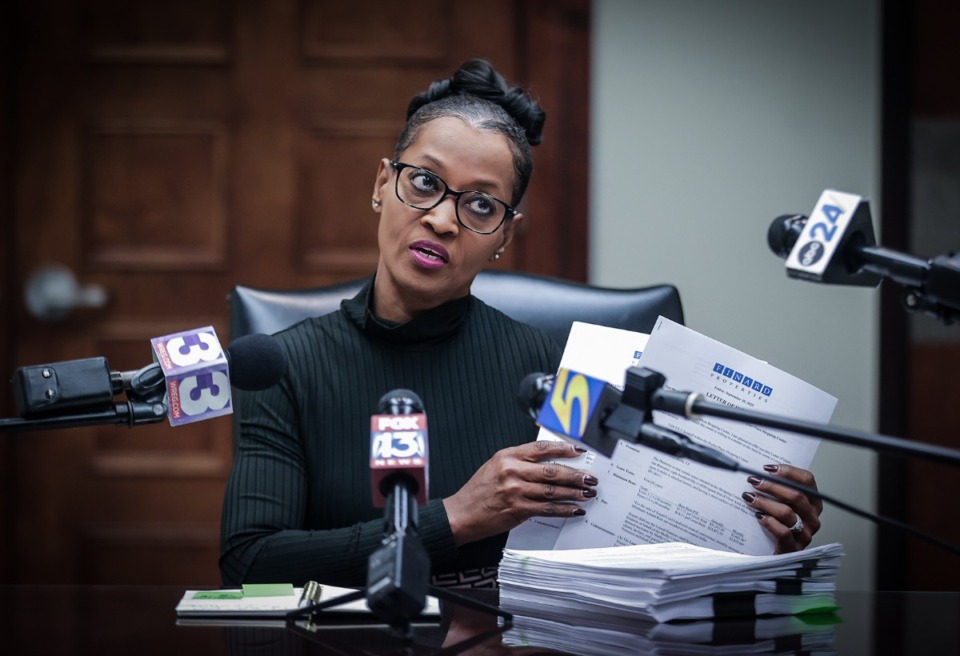 <strong>Shelby County Clerk Wanda Halbert holds up paperwork during a Nov. 9 press conference in her Downtown office.</strong> (Patrick Lantrip/The Daily Memphian)