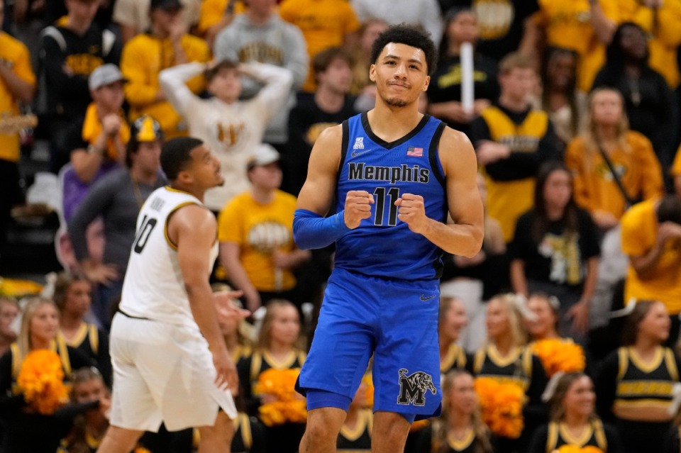 <strong>Memphis' Jahvon Quinerly (11) celebrates after making a 3-point basket during the second half of an NCAA college basketball game against Missouri Friday, Nov. 10, 2023, in Columbia, Mo. Memphis won 70-55</strong>. (AP Photo/Jeff Roberson)