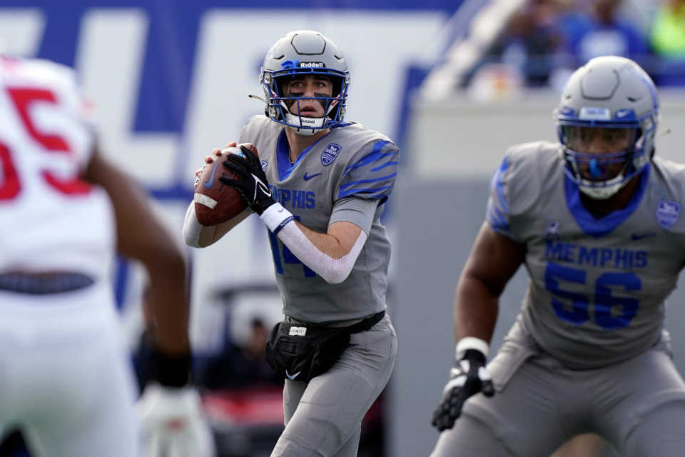 <strong>Memphis quarterback Seth Henigan, center, looks for a receiver in the first half of an NCAA college football game against SMU Saturday, Nov. 6, 2021, in Memphis. The Tigers&rsquo; 2023 game against SMU will determine if the the team&rsquo;s hopes to get into the American Athletic Conference Championship game stay alive.</strong>&nbsp;(Mark Humphrey/AP Photo file)