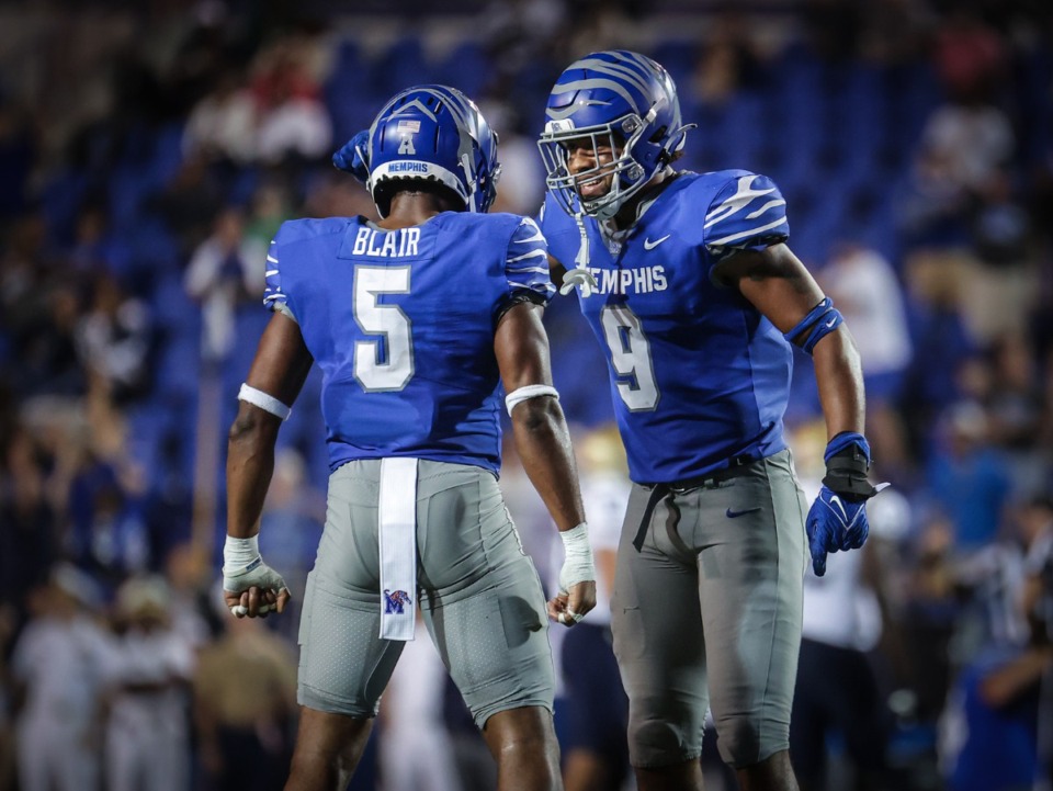 <strong>University of Memphis linebacker Geoffrey Cantin-Arku (9) celebrates a turnover with defensive back Simeon Blair (5) during a Sept. 15, 2023 game against Navy at Simmons Bank Liberty Stadium</strong>. (Patrick Lantrip/The Daily Memphian)