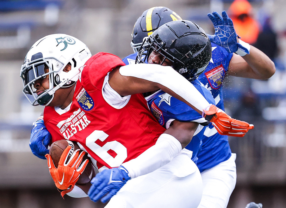<strong>Red Team running back Ghakobe Moore of FACS gets brought down by a pair of defenders during the AutoZone Liberty Bowl high school all-star football game Dec. 10, 2022.</strong> (Patrick Lantrip/The Daily Memphian file)