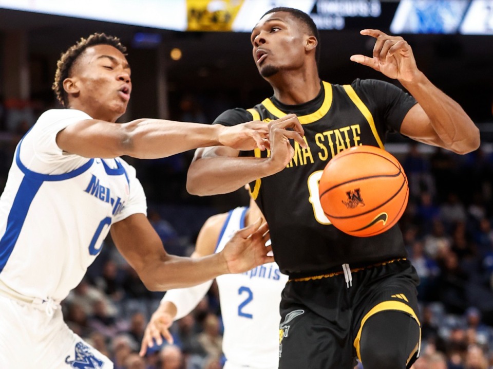 <strong>Memphis Tigers defender Jonathan Pierre (left) knocks the ball away from Alabama State forward D'Ante Bass (right) on Friday, Nov. 17, 2023 at FedExForum.</strong> (Mark Weber/The Daily Memphian)
