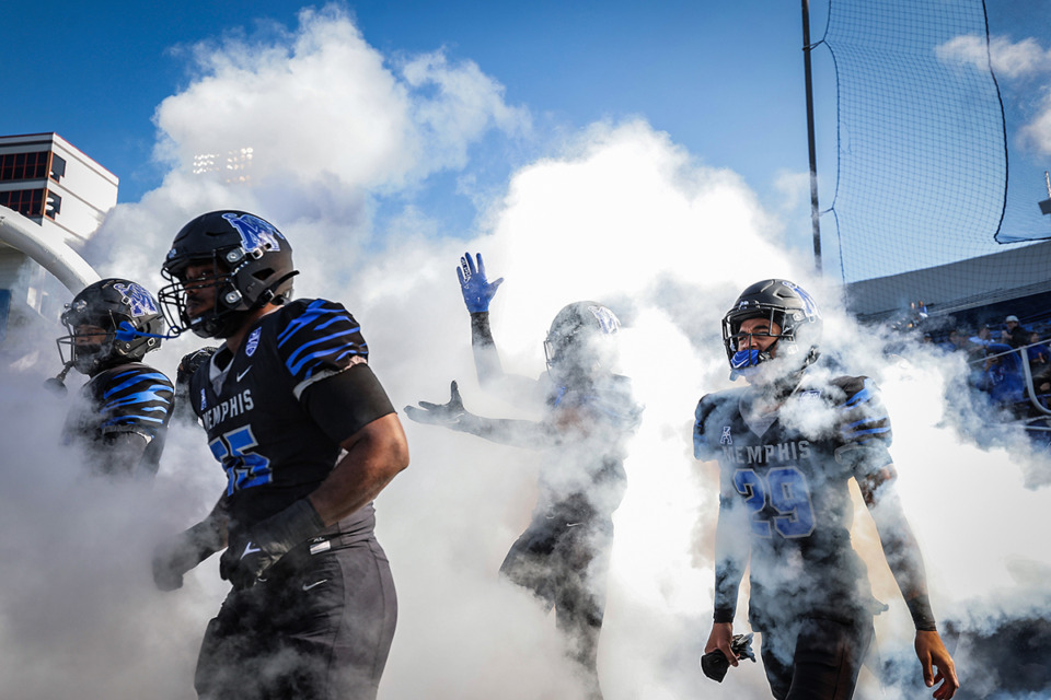 <strong>University of Memphis players take the field before a Nov. 18, 2023 game against SMU at Simmons Bank Liberty Stadium.</strong> (Patrick Lantrip/The Daily Memphian)