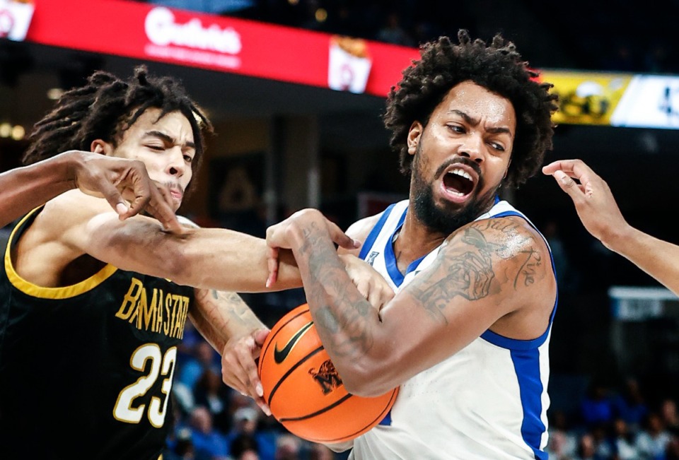 <strong>Memphis Tigers center Jordan Brown (rignt) grabs a round away from Alabama State defender Eric Coleman (left) during action on Friday, Nov. 17, 2023.</strong> (Mark Weber/The Daily Memphian)