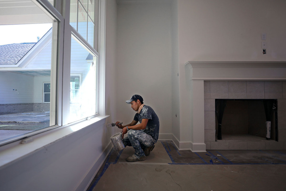 <strong>Romeo Domingo paints an interior wall of a house that was under construction in Arlington Oct. 30, 2020.</strong> (Patrick Lantrip/The Daily Memphian file)