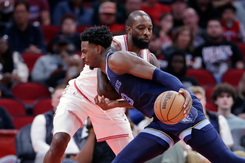 <strong>Memphis Grizzlies forward Jaren Jackson Jr., front, drives into Houston Rockets forward Jeff Green, back, on Wednesday, Nov. 22, 2023, in Houston.</strong> (Michael Wyke/AP)
