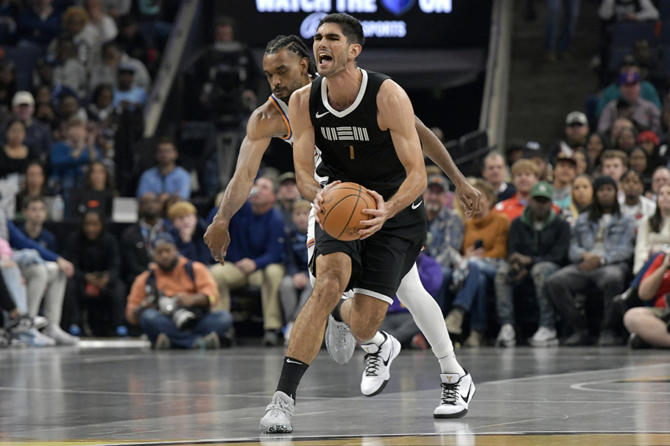 <strong>Memphis Grizzlies forward Santi Aldama is defended by Phoenix Suns forward Keita Bates-Diop during the first half of an NBA basketball In-Season Tournament game Nov. 24 in Memphis.</strong> (Brandon Dill/AP file)