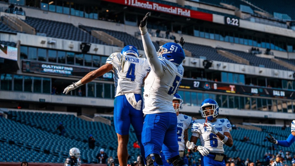 <strong>Running back Blake Watson and offensive lineman Terrance McClain (51) celebrate Friday, Nov. 24, 2023 at Lincoln Financial Field Stadium in Philadelphia, where the Tigers defeated Temple. Watson finished with 95&nbsp;rushing yards and a touchdown while making four&nbsp;catches for 39 yards and a touchdown.</strong> (Courtesy Memphis Athletics)