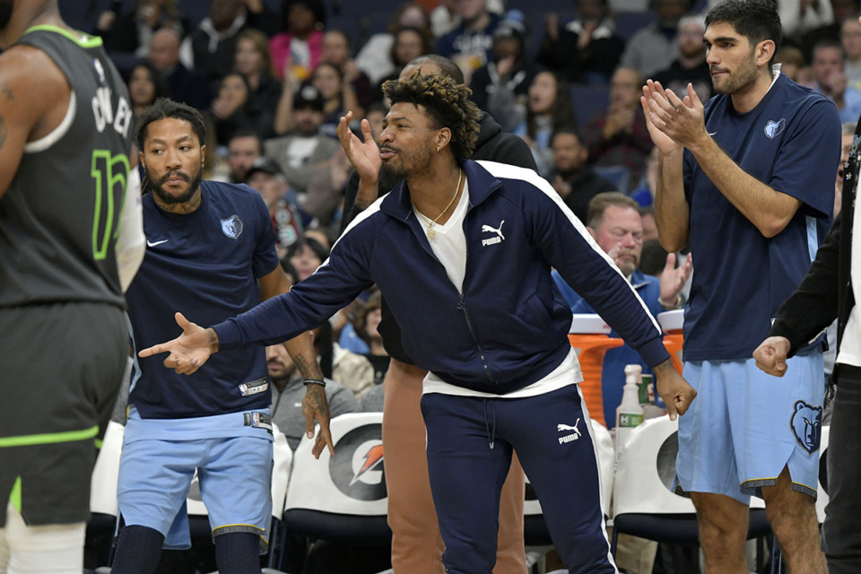<strong>Memphis Grizzlies guard Marcus Smart (center) reacts on the sideline of a game against the Minnesota Timberwolves on Sunday, Nov. 26, 2023, at FedExForum. (</strong>Brandon Dill/AP Photo)