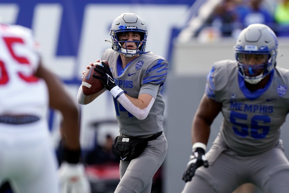 <strong>Memphis quarterback Seth Henigan, center, looks for a receiver in the first half of an NCAA college football game against SMU Saturday, Nov. 6, 2021, in Memphis, Tenn.</strong> (AP Photo/Mark Humphrey)