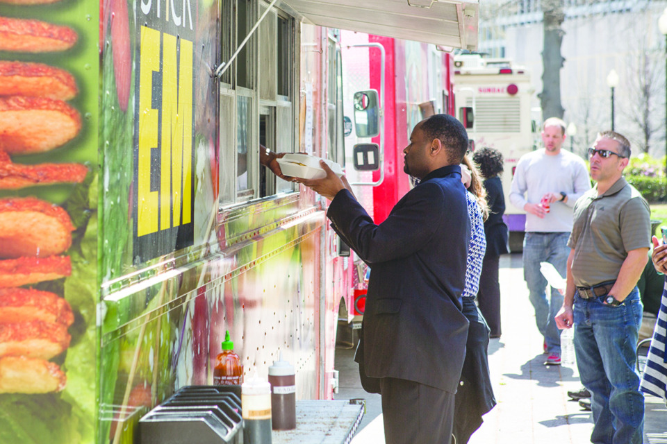 <strong>Lunch customers queue up at a food truck. Bartlett will allow mobile vending trucks if vendors have liability insurance and a plan for waste disposal.</strong> (The Daily Memphian file)&nbsp;