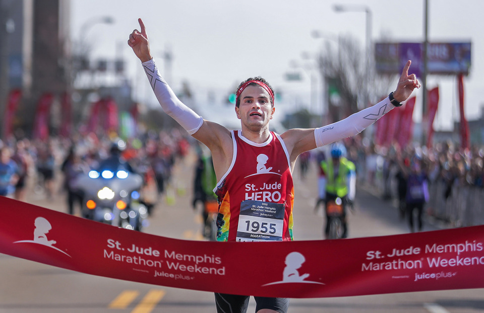 <strong>St. Jude Marathon winner Mo'Ath Alkhawaldeh crosses the finish line Dec. 3, 2022.</strong> (Patrick Lantrip/The Daily Memphian file)