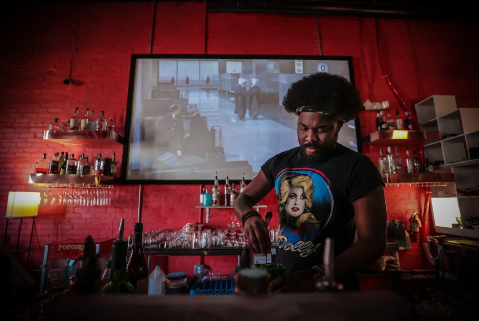 <strong>Aaron Ivory makes a drink at Masquerade, a new upscale bar at Black Lodge in Midtown Nov. 29.</strong> (Patrick Lantrip/The Daily Memphian)