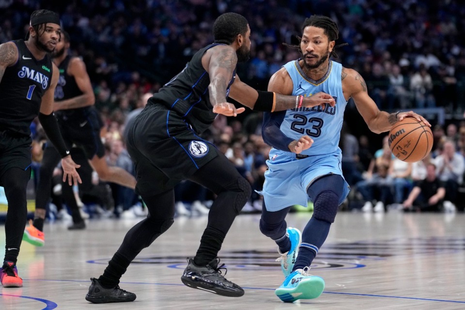 <strong>Memphis Grizzlies guard Derrick Rose (23) works to the basket against Dallas Mavericks guard Kyrie Irving, front left, in Dallas, Friday, Dec. 1, 2023.</strong> (Tony Gutierrez/AP)