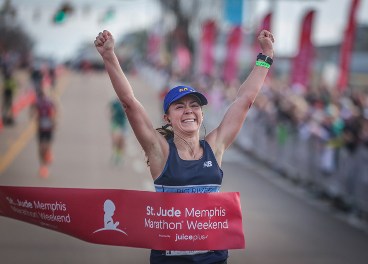 <strong>Sadie Smith celebrates finishing as the top female racer at the St. Jude Memphis Marathon Dec. 2.</strong> (Patrick Lantrip/The Daily Memphian)