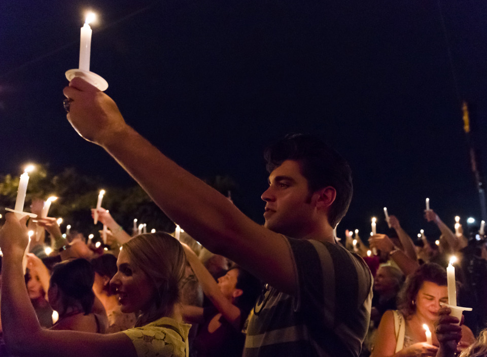 <strong>Elvis fans pay tribute to the singer's legacy during the annual candlelight vigil at Graceland on Aug. 15, 2018. The city drew a record 11.8 million visitors in 2018, and this year is expected to better, according to Memphis Tourism.&nbsp;</strong>(Houston Cofield/Daily Memphian file)