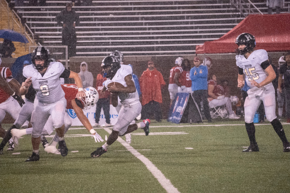 <strong>Houston running back Damon Sisa carries the football during Saturday&rsquo;s Class 6A state championship game against Murfreesboro Oakland. Sisa had 179 rushing yards to help the Mustangs win the school&rsquo;s first state football title.</strong> (Courtesy Larry Knox of Kelly Day Portraits)