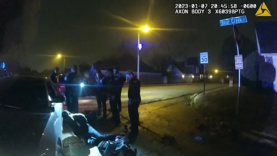 <strong>Body camera footage shows two Memphis Fire Department EMTs and four Memphis Police Officers standing near Tyre Nichols</strong>. (Screenshot from Video 4)