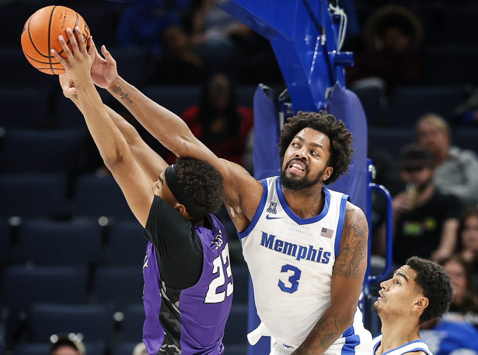 <strong>Memphis Tigers center Jordan Brown (right) ballets for a rebound against LeMoyne-Owen College forward Matt Spears (left) during action on Nov. 2. Brown will be out for the Tigers&rsquo; game against VCU Wednesday, Dec. 6.</strong> (Mark Weber/The Daily Memphian file)
