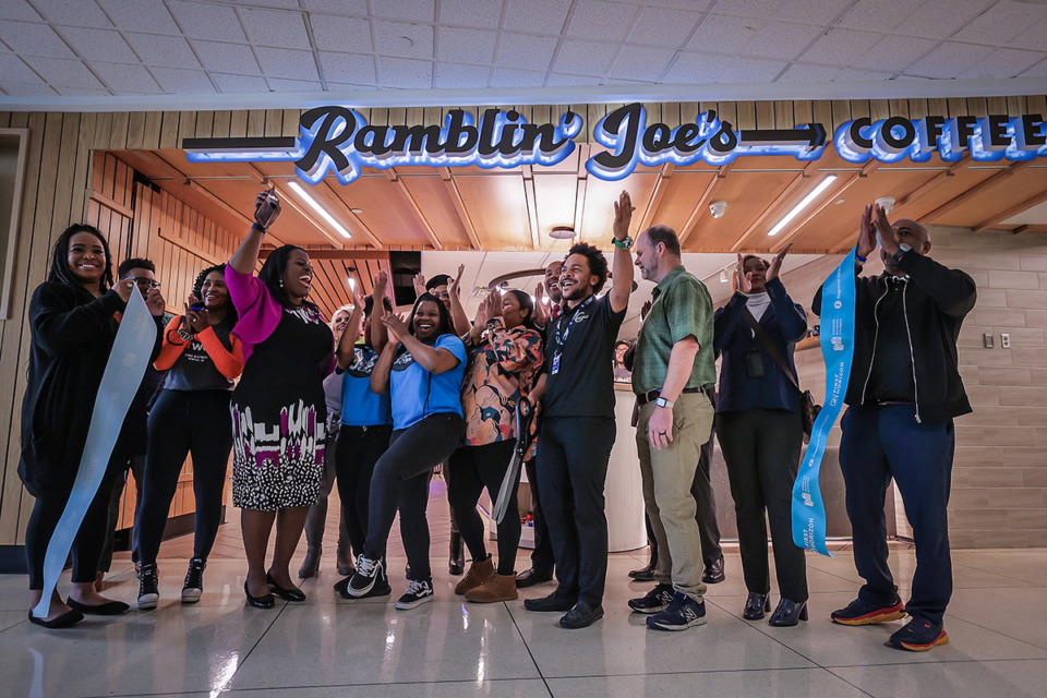 <strong>Members of the Greater Memphis Chamber kicked off a Taste of MEM event at Memphis International Airport with a ribbon-cutting for a new Ramblin' Joe's Coffee location Dec. 5.</strong> (Patrick Lantrip/The Daily Memphian)