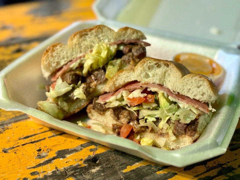 <strong>The torta de lengua is packed with&nbsp; iceberg lettuce, chunks of avocado, diced roma tomatoes, melty cotija cheese and a couple of slices of fried ham.&nbsp;</strong>(Joshua Carlucci/Special to The Daily Memphain)