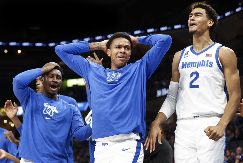 <strong>Memphis Tigers teammates (left to right) Carl Cherenfant, Ashton Hardaway and Nicholas Jourdain celebrate on the bench during action against Alabama State on Friday, Nov. 17.&nbsp;Memphis will join forces with&nbsp;Bluff City Collective in an effort to increase name, image and likeness (NIL) funds.&nbsp;</strong>(Mark Weber/The Daily Memphian file)