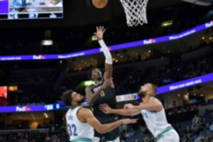 <strong>Memphis Grizzlies forward Jaren Jackson Jr. (13) shoots over Minnesota Timberwolves centers Karl-Anthony Towns (32) and Rudy Gobert during the first half of an NBA basketball game Friday, Dec. 8 at FedExForum.</strong> (AP Photo/Brandon Dill)