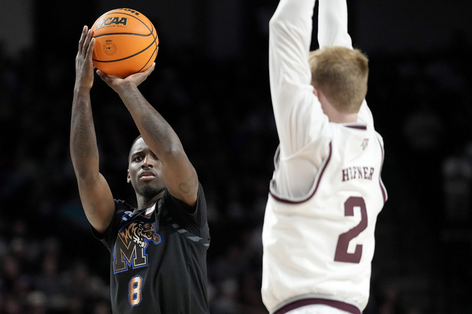 <strong>Memphis forward David Jones (8) prepares to make a 3-point basket as Texas A&amp;M guard Hayden Hefner (2) is late to defend during the second half of an NCAA college basketball game Sunday, Dec. 10, 2023, in College Station, Texas.</strong> (Sam Craft/AP Photo)