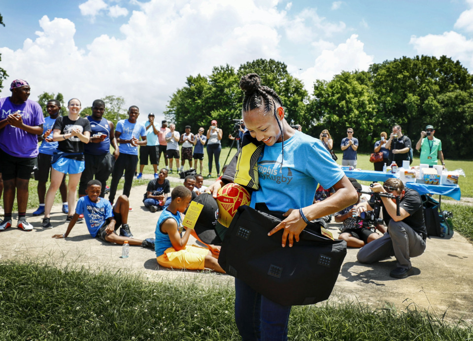 <strong>Memphis Inner City Rugby player Jamiyah Brown, 11, was surprised during an event Friday, June 28, with the opportunity to deliver the official game ball at the Rugby World Cup 2019 in Japan, courtesy of DHL Express. Jamiyah will deliver the game ball to the professional athletes representing the U.S.</strong> (Mark Weber/Daily Memphian)