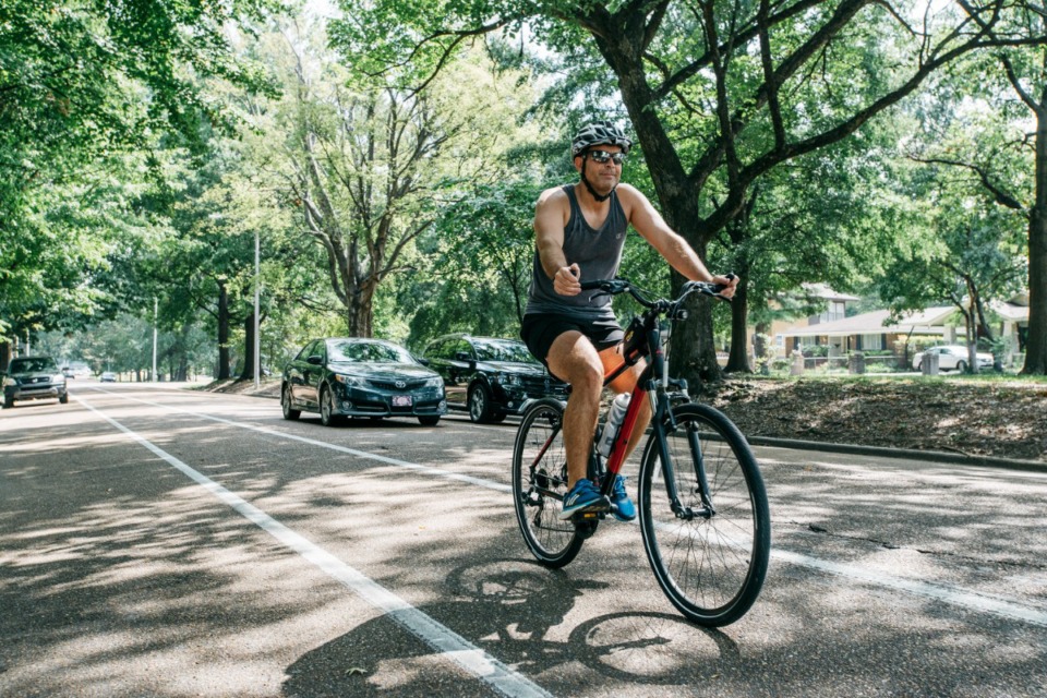 <strong>A cyclist in the bike lane rides west along North Parkway. Regarding Summer Avenue, Elijah Andrews (not pictured) says that&nbsp;&ldquo;bike networks and pedestrian connections shouldn&rsquo;t need to wait for the next multi-million dollar project.&rdquo; </strong>(Daily Memphian file)