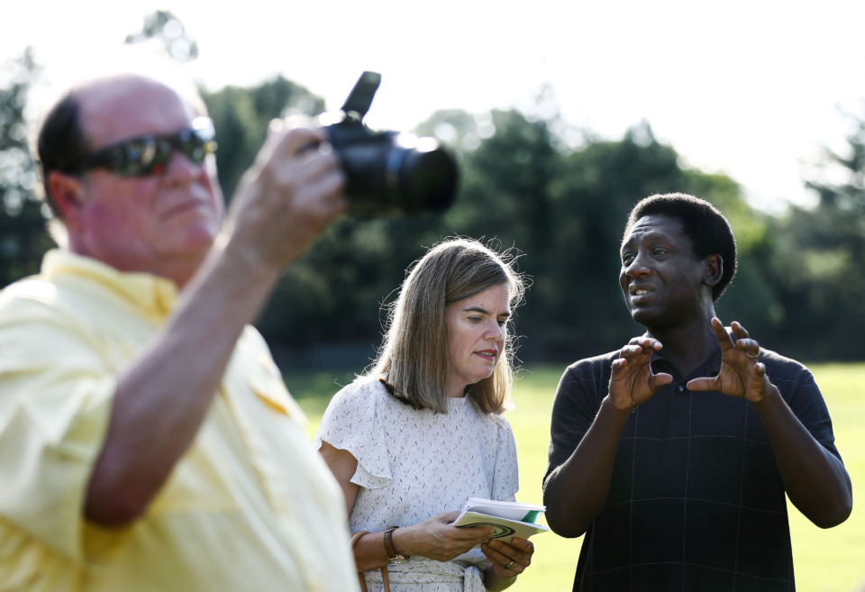 <strong>District Attorney Amy Weirich (middle) speaks with Kevin Reed during the Elephants in the Park event Friday evening at Marquette Park in East Memphis.</strong> (Mark Weber/Daily Memphian)