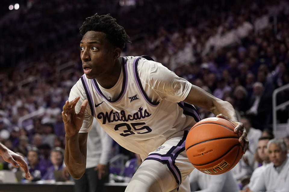 <strong>Former Kansas State forward Nae'Qwan Tomlin drives during the second half of an NCAA college basketball game against Texas Feb. 4 in Manhattan, Kan. Texas won 69-66.</strong> (Charlie Riedel/AP file)