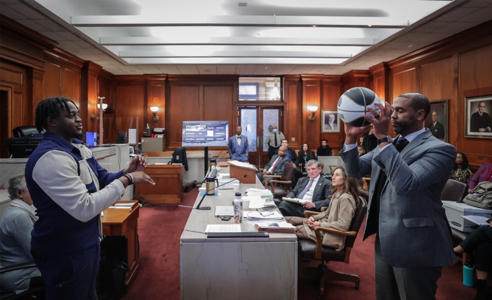 <strong>Attorney Keenan Carter (right) demonstrates a chest pass with Davonte Pack during a hearing in Judge Carol Chumney&rsquo;s civil court on Dec. 12, 2023</strong> <strong>in Memphis, Tenn. The hearing is to determine whether Ja Morant used self defense during a fight last summer at his home.</strong> (Patrick Lantrip/The Daily Memphian)